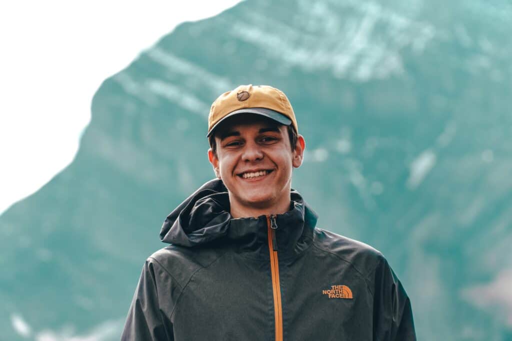 Man standing in front of mountain