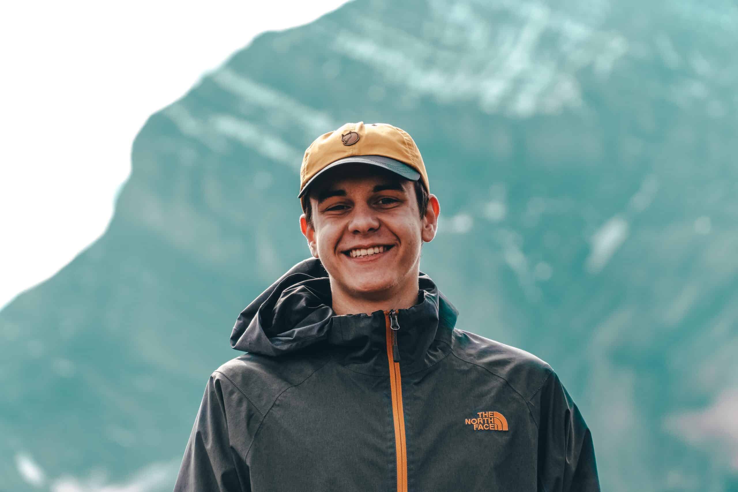 Man standing in front of mountain