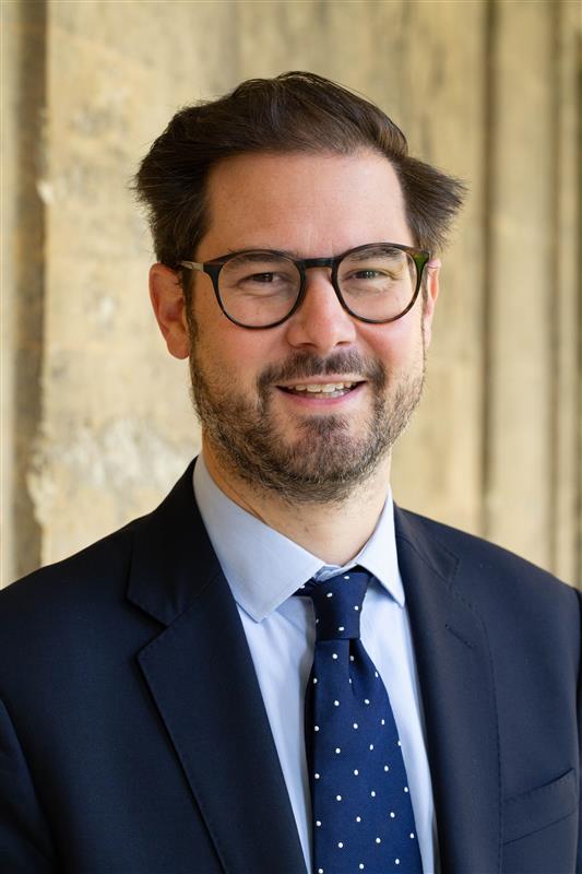 Justin Jacobs profile photo taken by David Olds against the Queen's stone