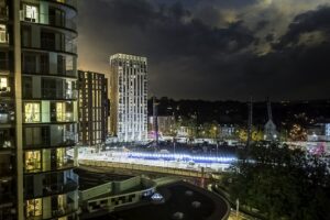 Lewisham at night with station Victorian terrace St Stephen's church and building site