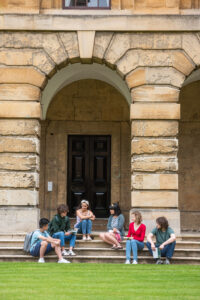 students on the steps in the cloister