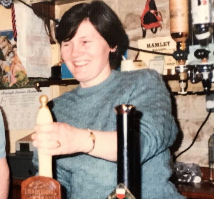 Val behind the bar in the Beer Cellar
