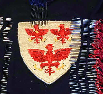 Needle and threads with Queen's College Crest