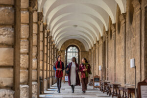three students in the cloister