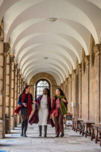 three students in the cloister