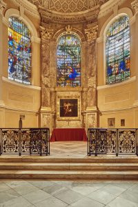 Chapel interior showing the altar and stained glass windows