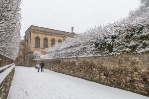 Queen's Lane in the snow with a view of Queen's College library building