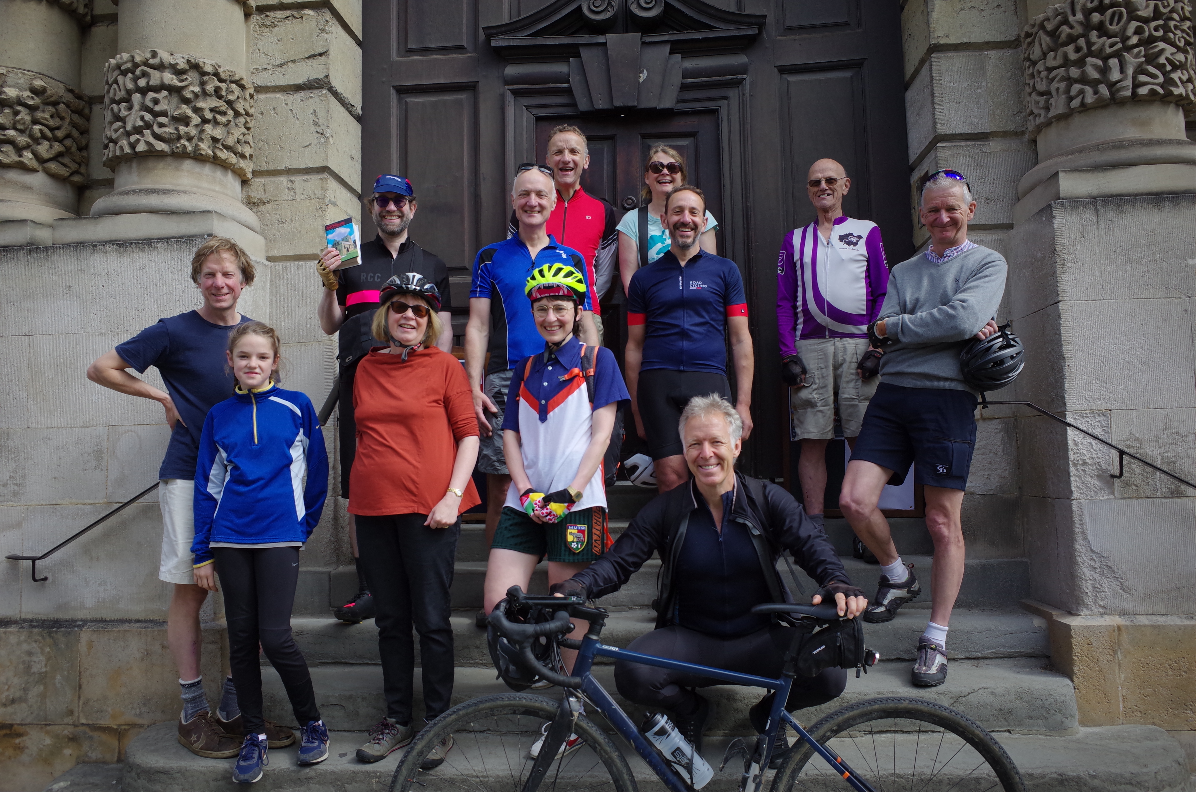 the College team on the stone entrance steps