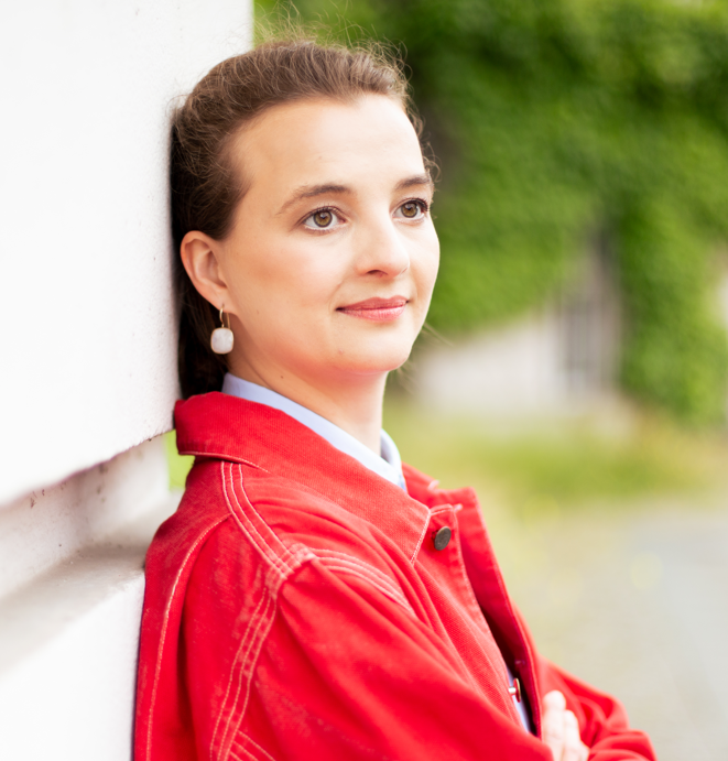 Image of Elisa Leroy wearing a red jacket