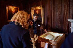 Librarian Matt Shaw showing visitors the First Folio