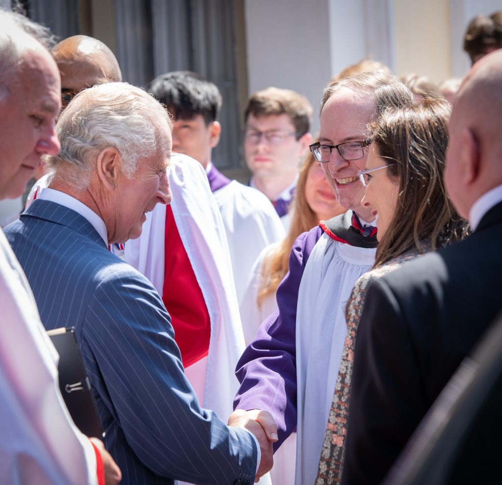 Choir Director Prof Owen Rees shakes hands with King Charles III