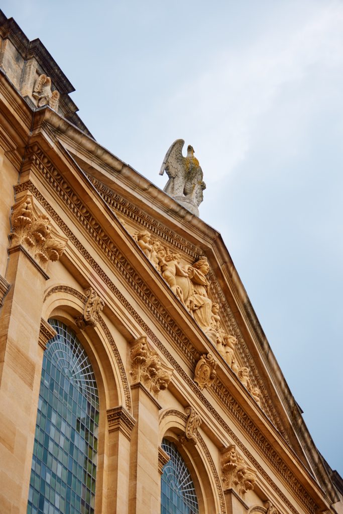 the stone eagle on top of the library building