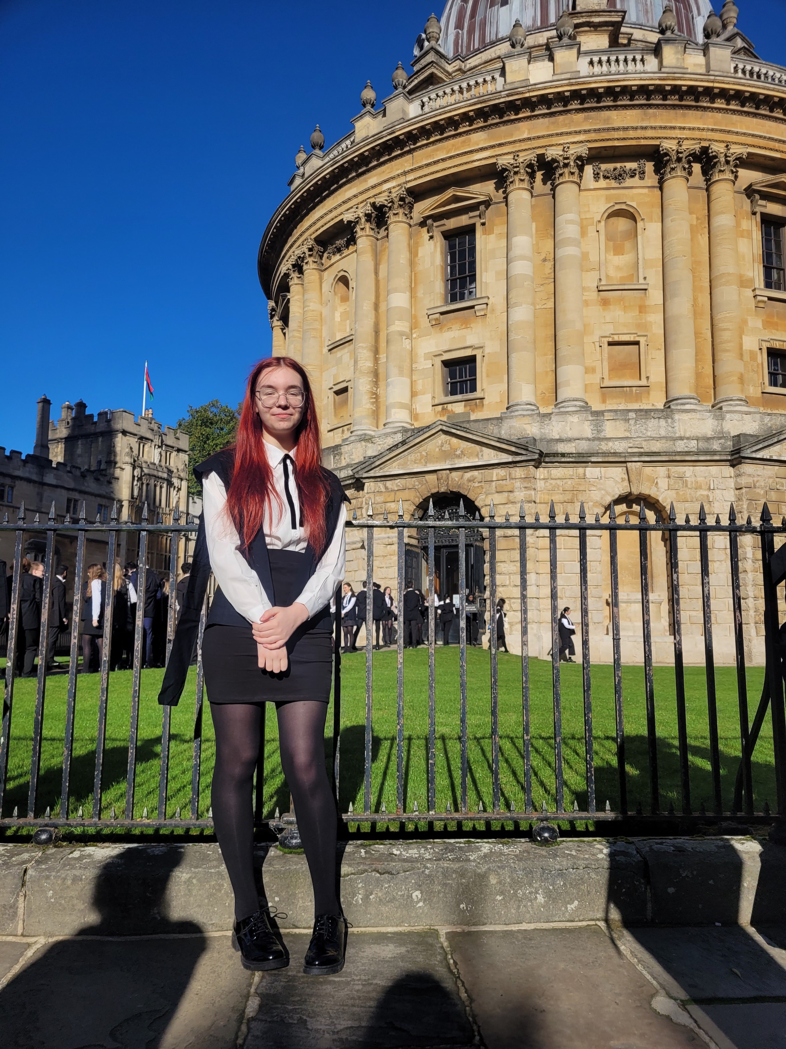 Heather standing outside the Radcliffe Camera wearing subfusc