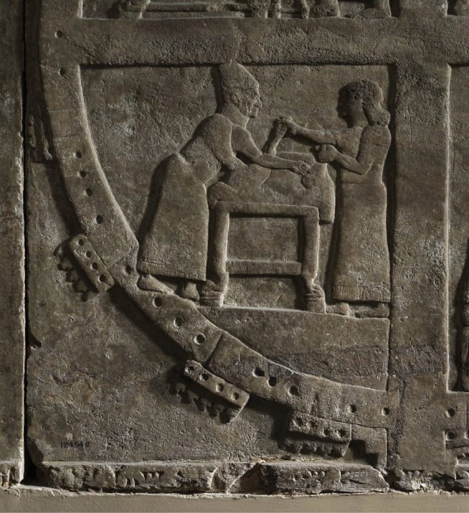 neo-Assyrian relief depicting diviners conducting an extispicy in a military camp