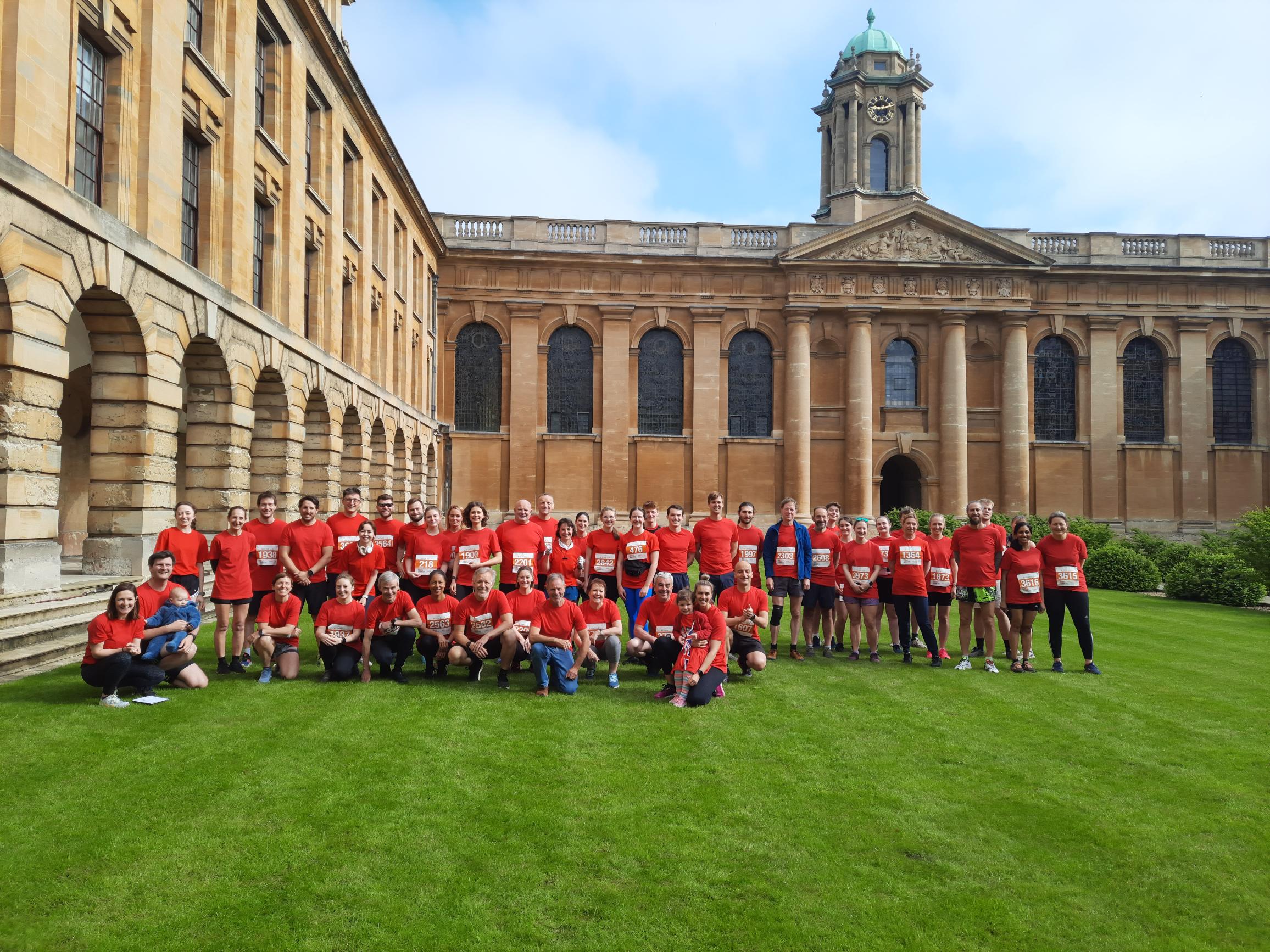 The College town and gown team in 2023 pictured in Front Quad wearing red team t-shirts