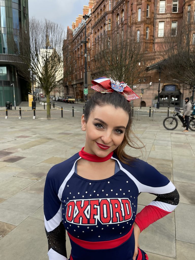 Olivia Coombs in cheerleading kit