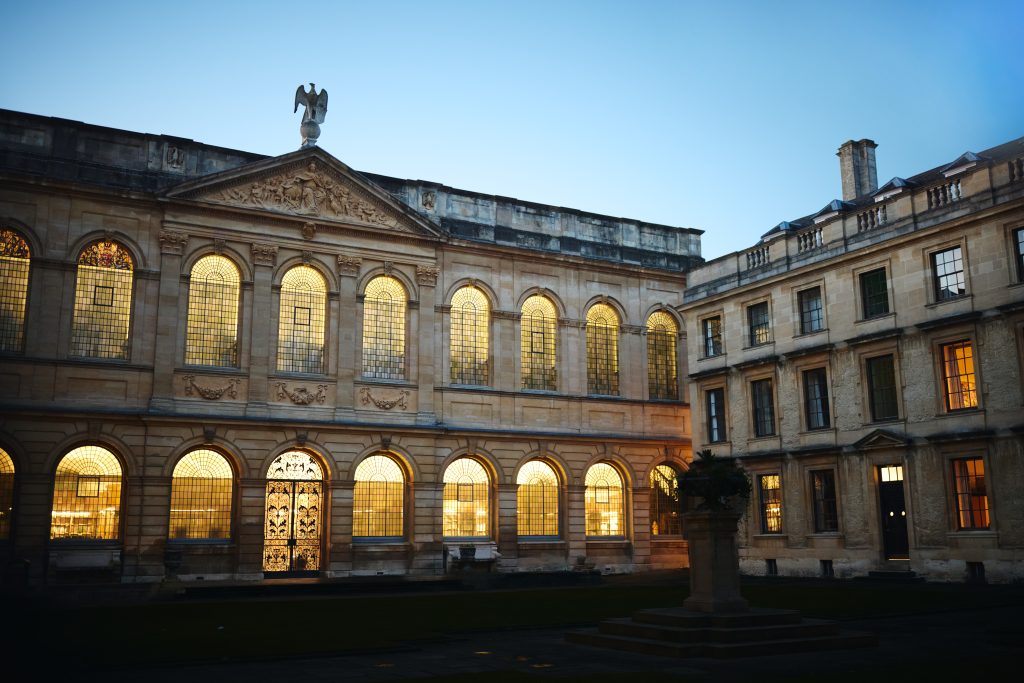 Back Quad at night time showing with the library windows illuminated Back Quad at night time showing the lights in the library windows