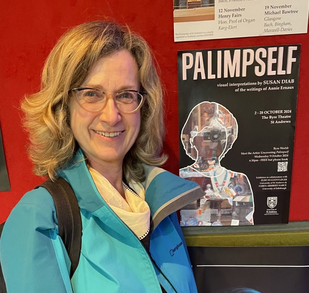 a photo of Susan Diab standing next to he exhibition poster for Palimpself