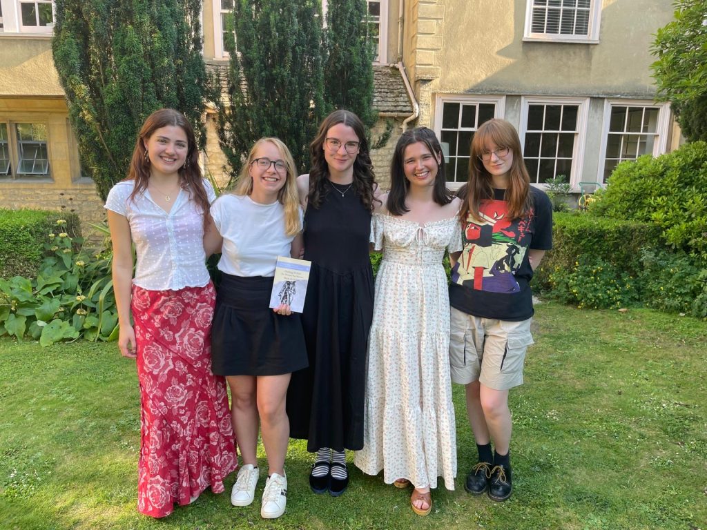 Marie Martine and her student translators standing in the Drawda Garden