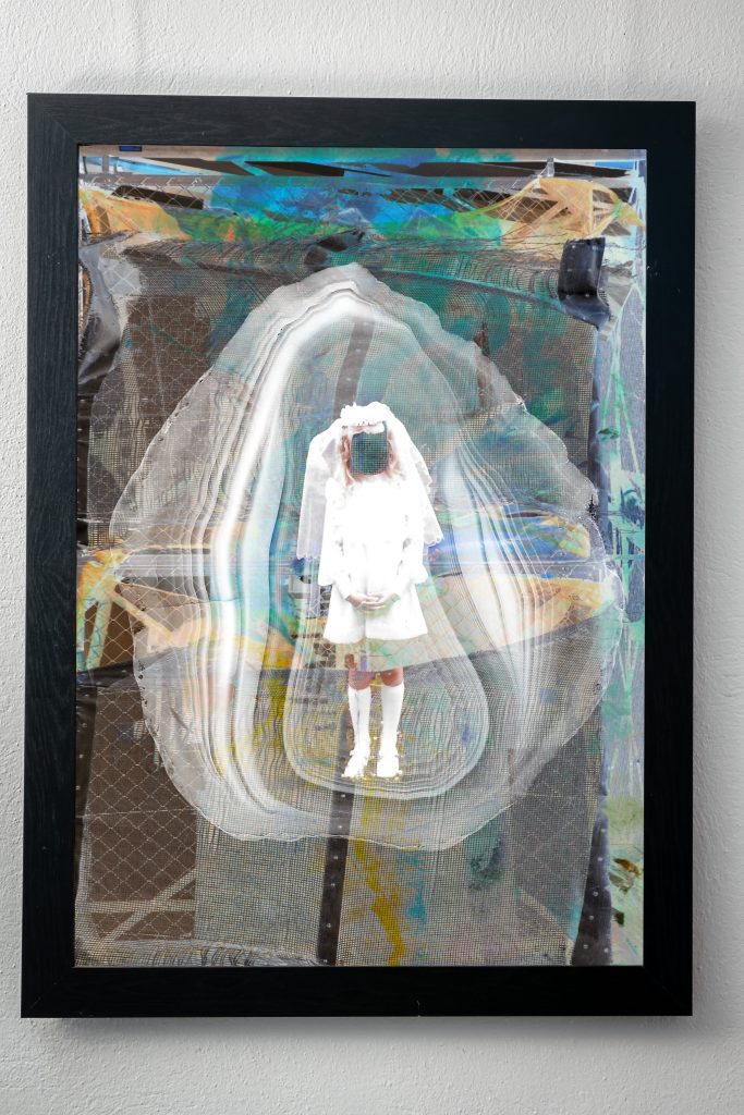 a framed piece of art by Susan Diab which has been created with multiple layers