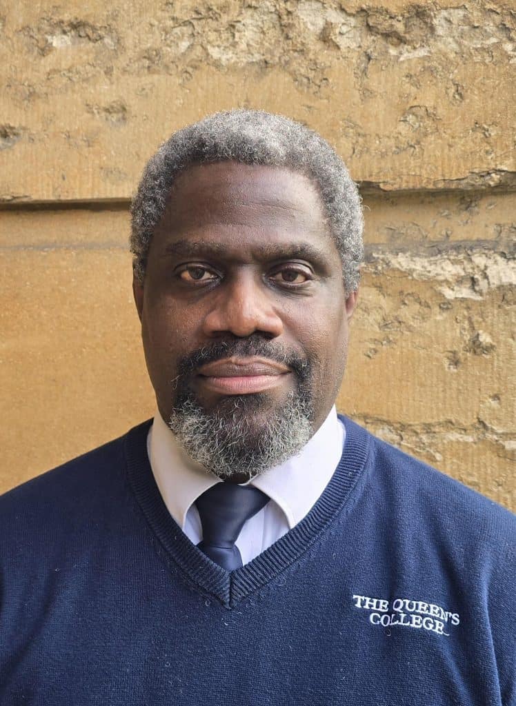 Clive's profile photo against the College stone