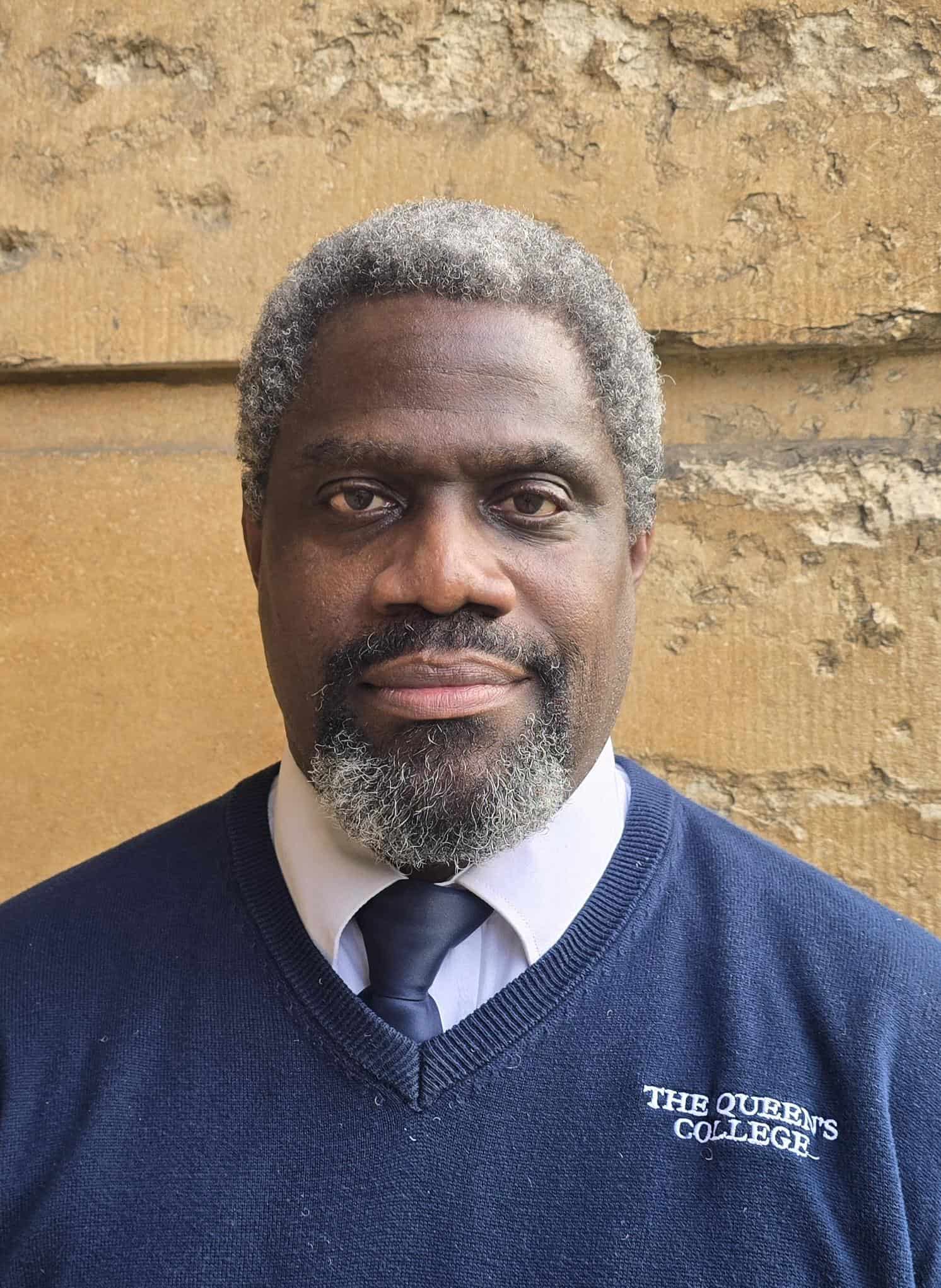 Clive's profile photo against the College stone