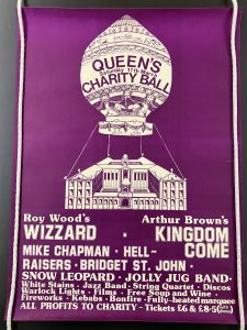 Poster for the 1973 cancelled ball. There's a purple background and a drawing of a hot air balloon tethered to the College