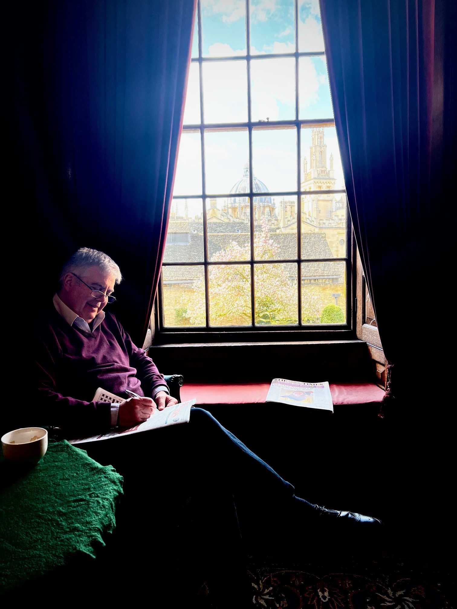 Prof Robert Taylor seated in the window of the Senior Common Room