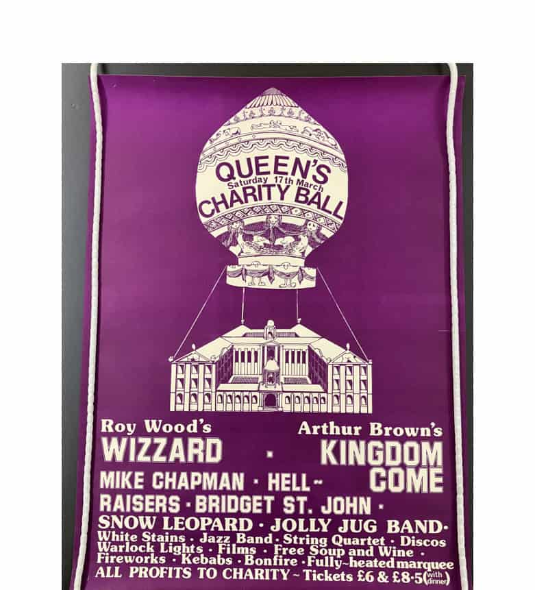 Poster for the 1973 cancelled ball. There's a purple background and a drawing of a hot air balloon tethered to the College