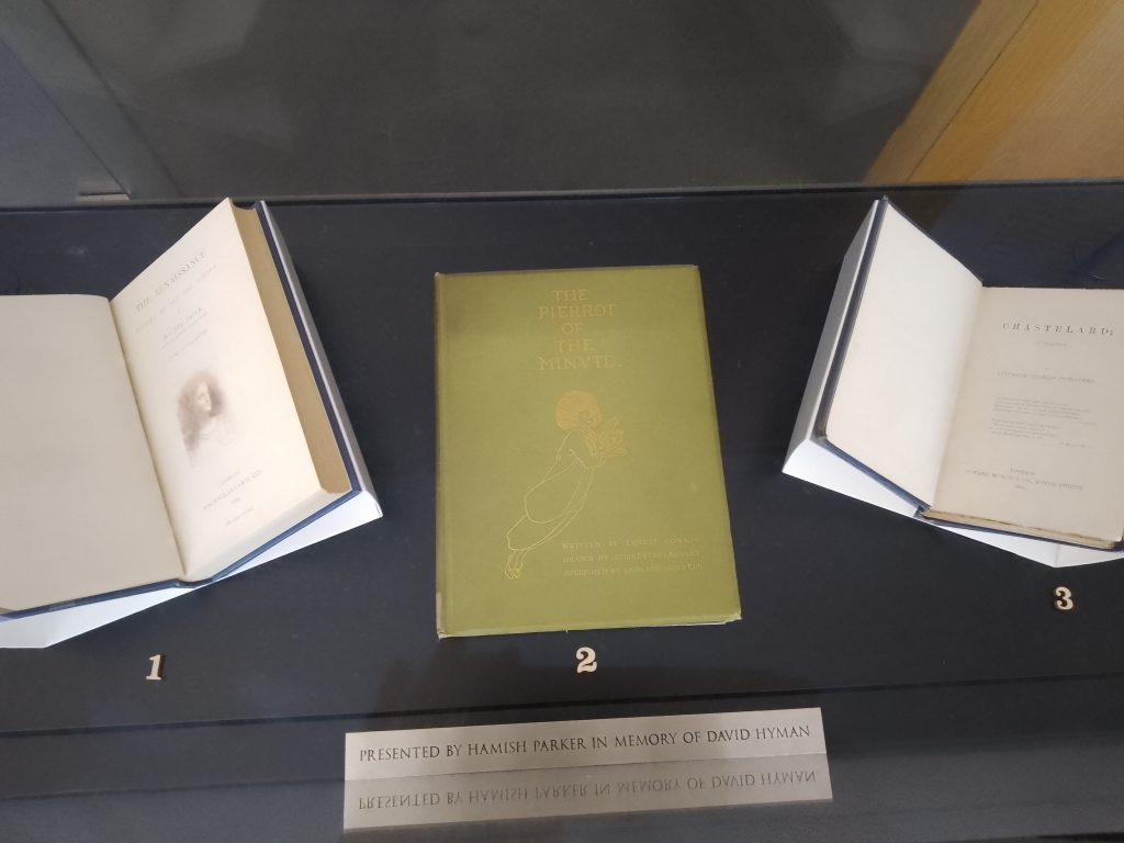 The exhibition case in the New Library showing three books