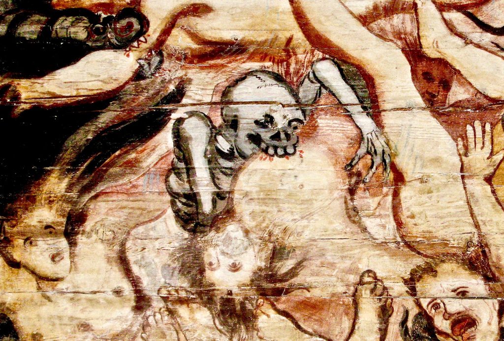 an illustration of a vampire chewing a person. The vampire appears in skeleton form.