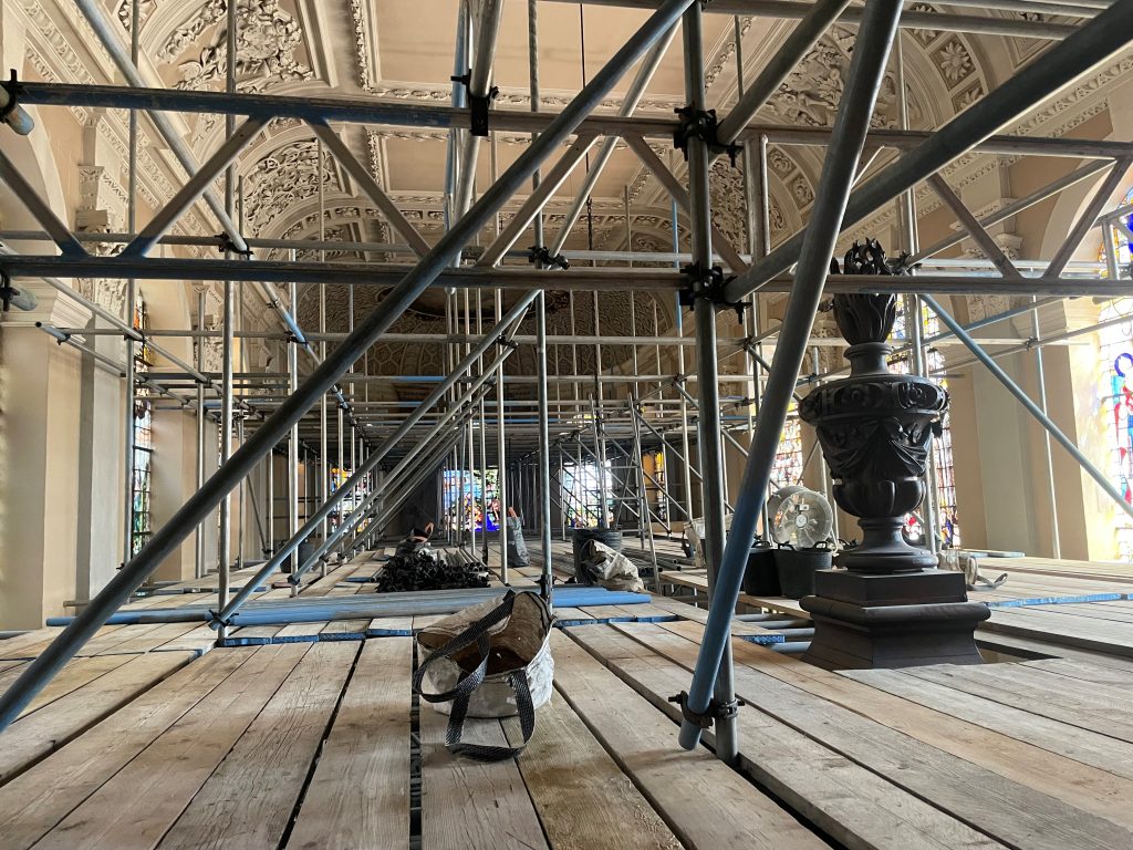 Top of the timber screen through Chapel scaffolding
