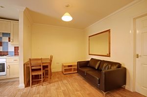 Living Room at Venneit Close showing sofa, wooden table and chairs