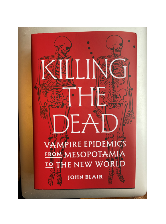 book cover of Killing the Dead. The background is red with two black skeleton drawings and title text in white. Sub-title and author text as follows: 'Vampire epidemics from Mesopotamia to the New World' by John Blair.