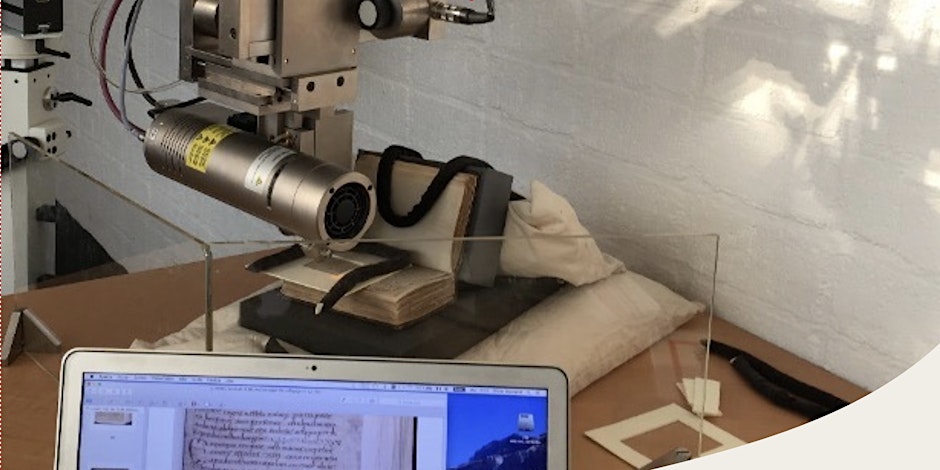 a manuscript on a viewing device with a laptop in the foreground