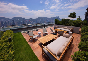 Outside terrace overlooking Hong Kong Central skyline and mountains in the background