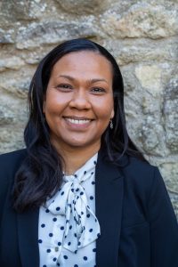 Dr Nakita Noel profile shot against stone wall