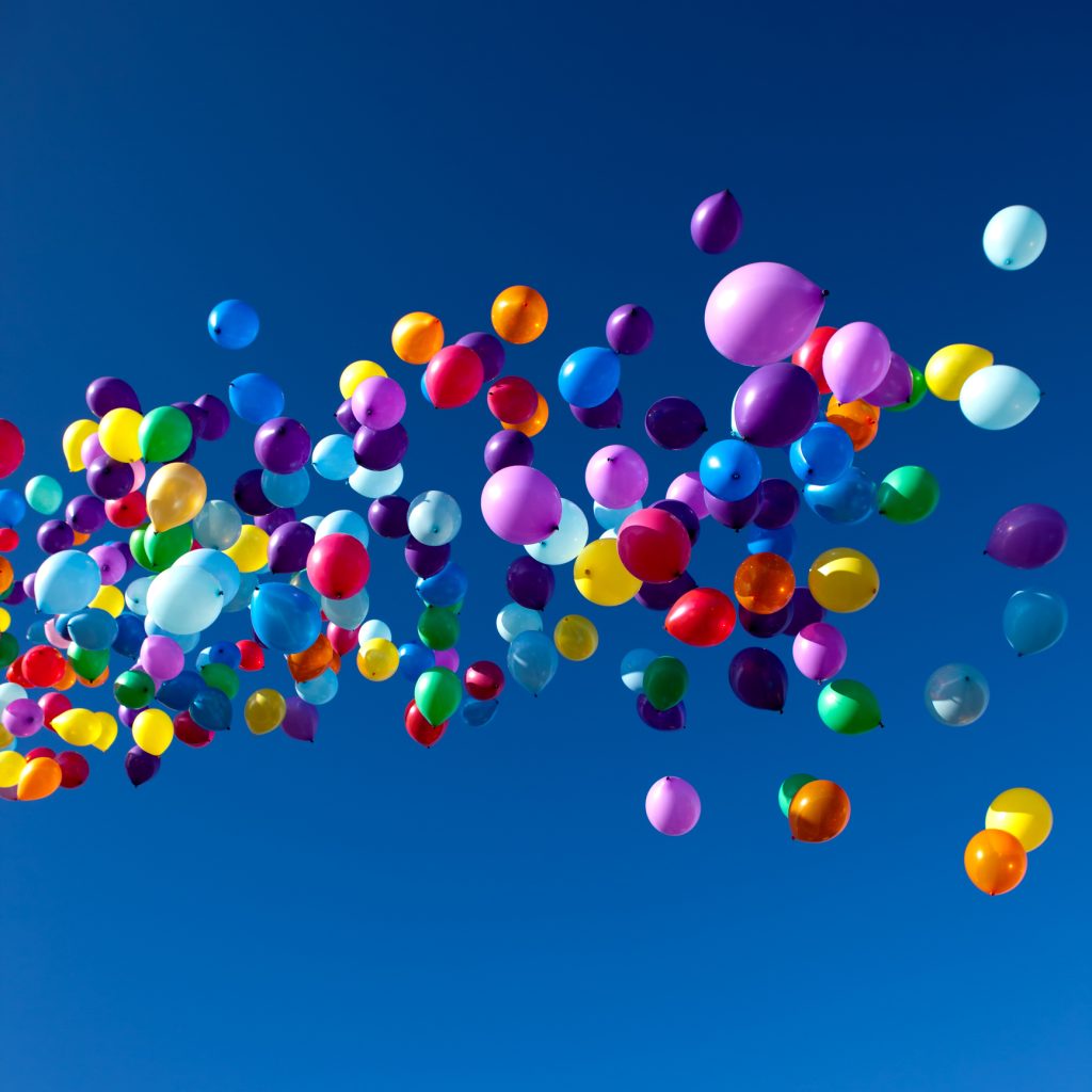 colorful balloons on a blue sky background