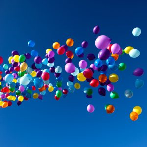 colorful balloons on a blue sky background
