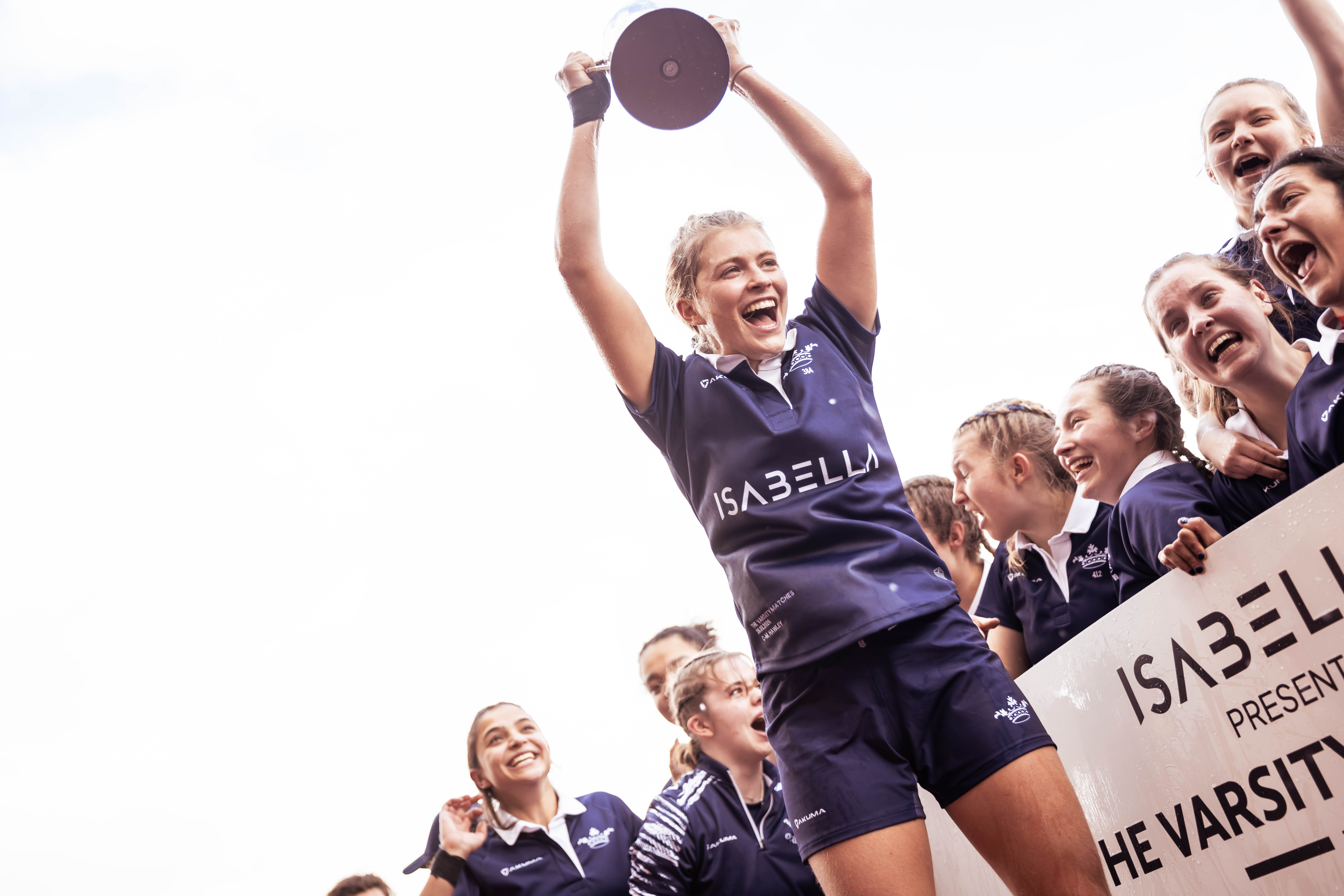 Chloe-Marie Hawley holds aloft the varsity trophy
