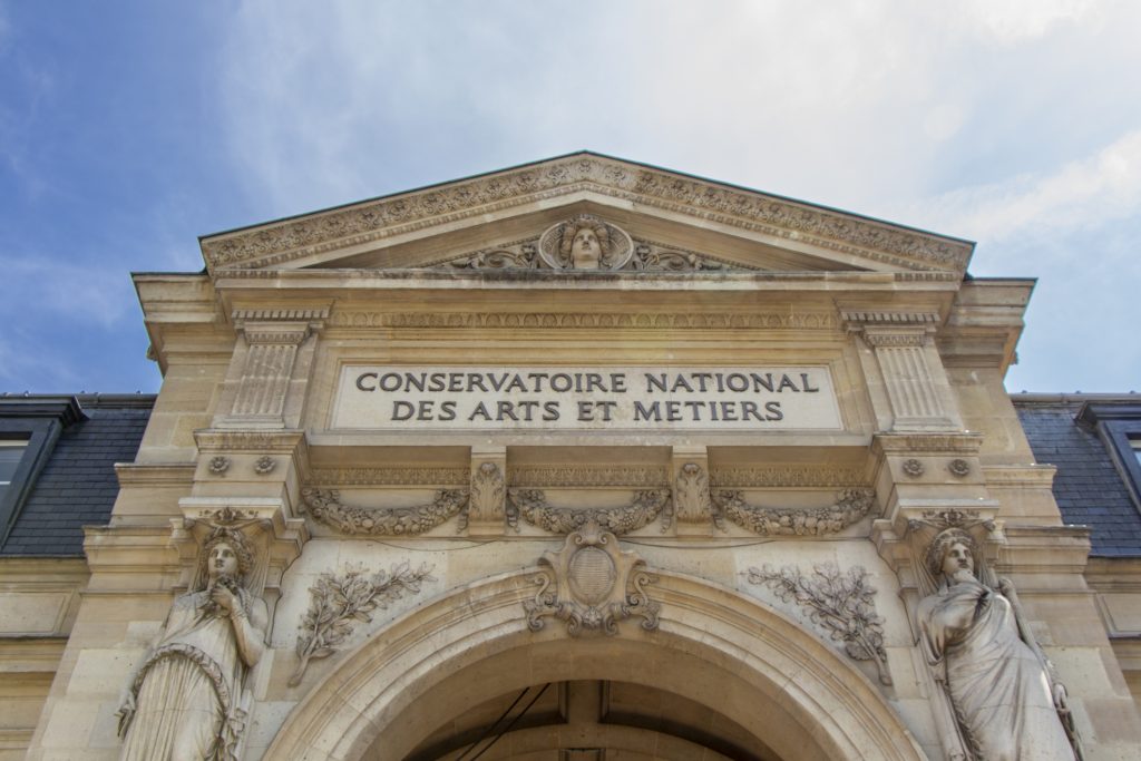 Paris, France, April 21 2022 : Facade of the Conservatoire national des arts et métiers (English: French National Conservatory of Arts and Crafts), on a sunny day.