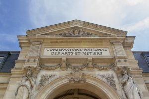 Paris, France, April 21 2022 : Facade of the Conservatoire national des arts et métiers (English: French National Conservatory of Arts and Crafts), on a sunny day.