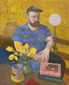 a painting by Jonathan Chan. The subject is a man sitting at a table containing a pile of books, cups of tea and a vase of flowers. The man is bearded and wearing a cap.