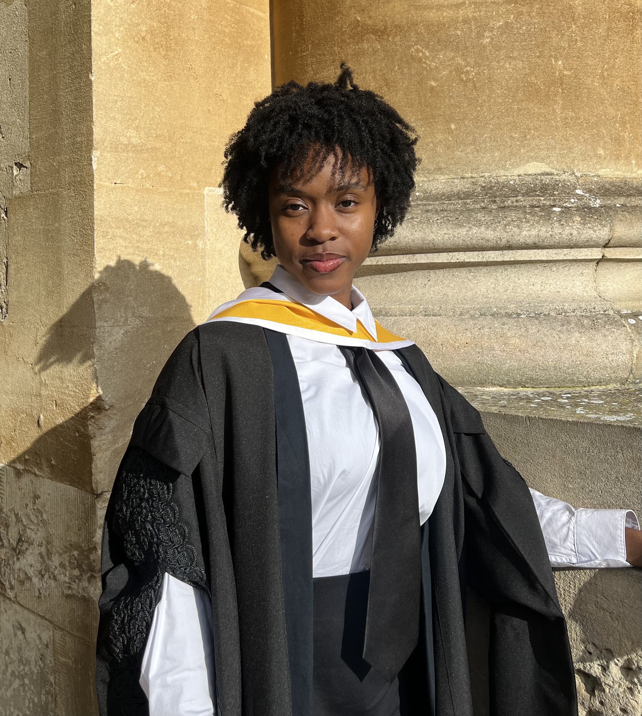 Cerena Parkinson pictured in academic dress in Queen's College