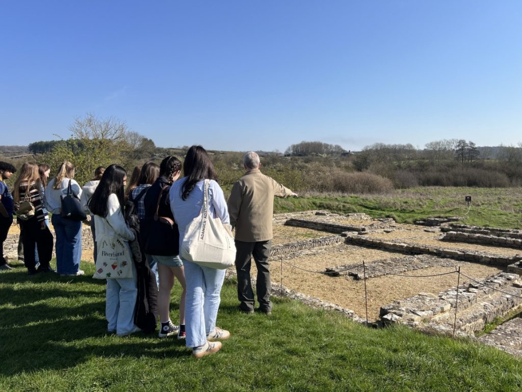 a school group on a sunny day at North Leigh Roman Villa