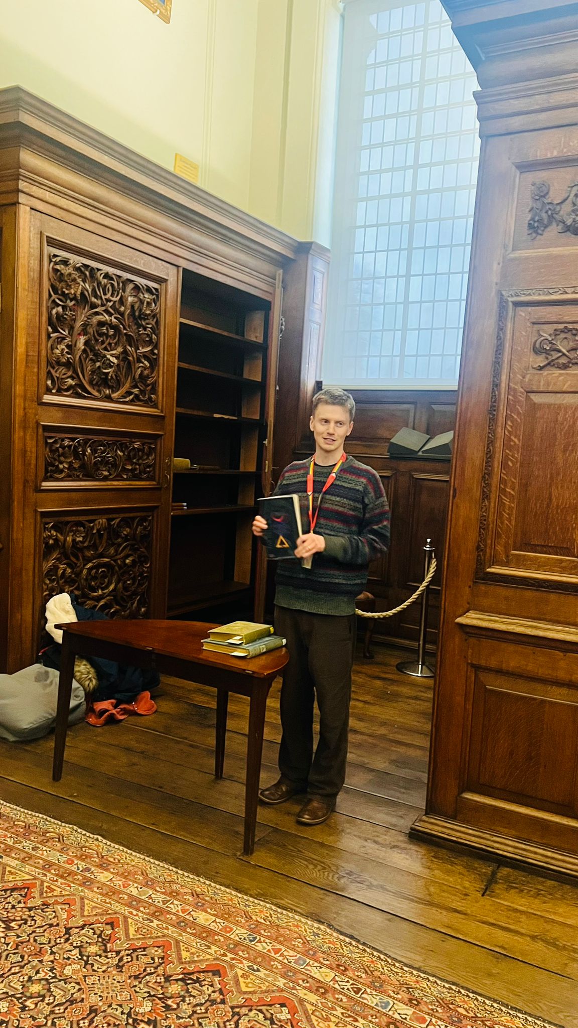 Felix pictured in the Upper Library holding his book