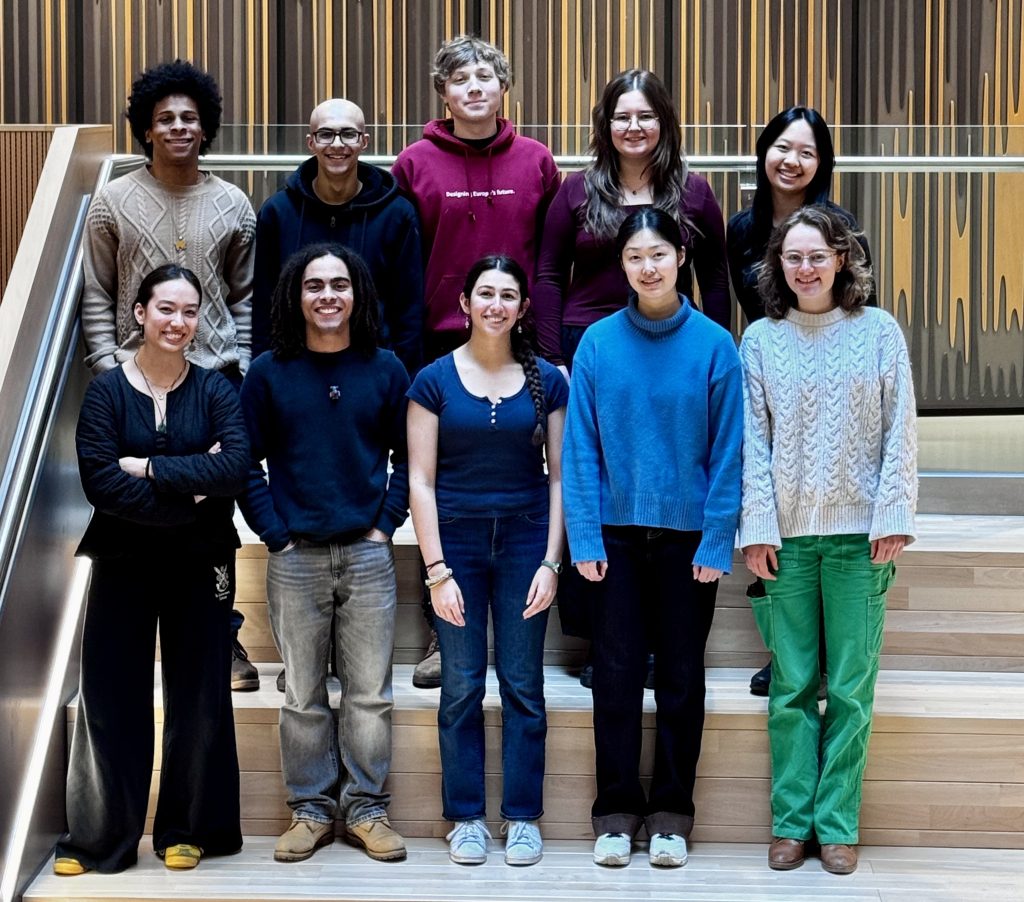igem team photo showing ten students lined up in two rows on some stairs