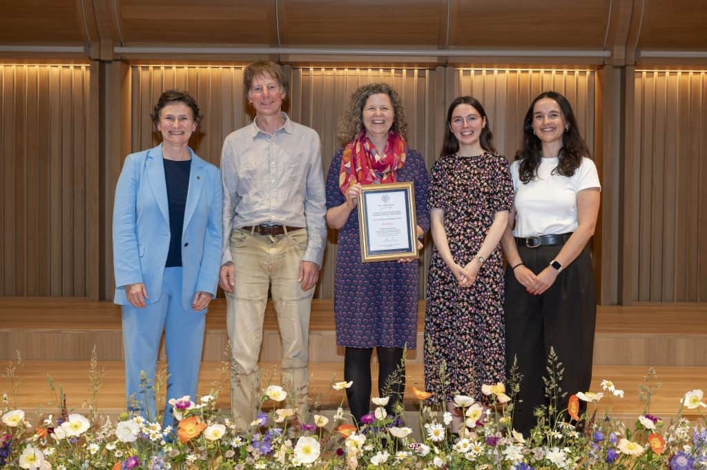 The QTE team with the Vice-Chancellor on stage at the awards ceremony
