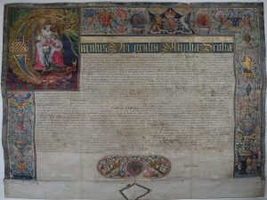 The Letters Patent of Charles I, granted to Queen's College in 1626, showing the border and illumination.