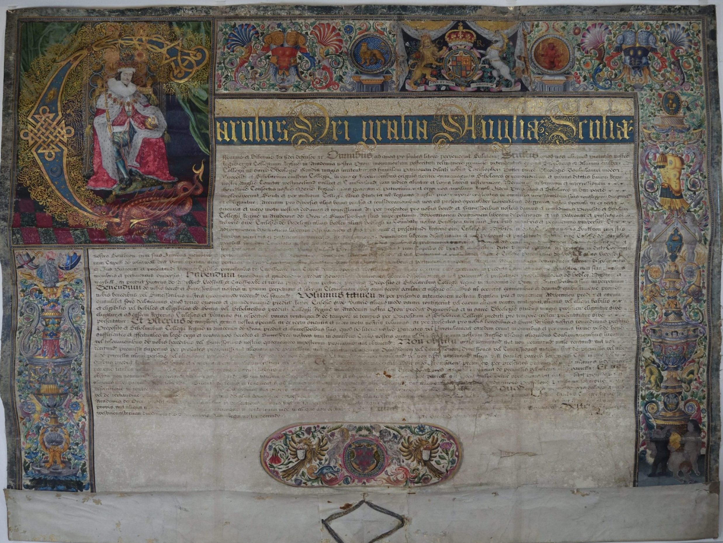 The Letters Patent of Charles I, granted to Queen's College in 1626, showing the border and illumination.